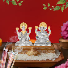 Load image into Gallery viewer, DIVINITI 999 Silver Plated Laxmi Ganesh Idol Statue Exquisite Symbol of Fortune and Blessings for Home Office Décor, Tabletop, Puja Room Gift (10x7.5 CM)
