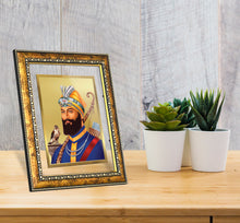 Load image into Gallery viewer, DIVINITI Guru Gobind Singh Gold Plated Wall Photo Frame, Table Decor| DG Frame 113 Size 2.5 and 24K Gold Plated Foil (29 CM X 23.7 CM)
